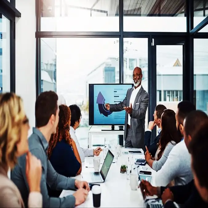 Presenter leading a training session in a meeting room